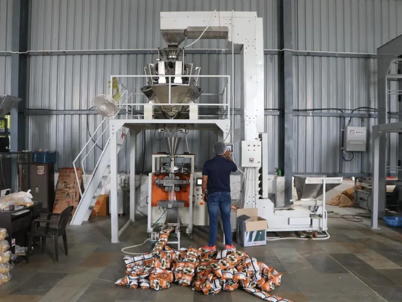 Snack production line with packing machine